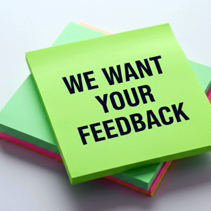 We want your feedback written on stack of Post-Its 