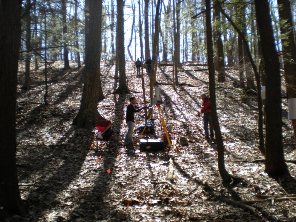  Researchers in the woods investigating rates of weathering in Pennsylvania. Credit: Penn State.