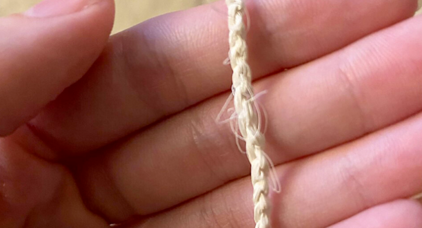 hand holding a braided material