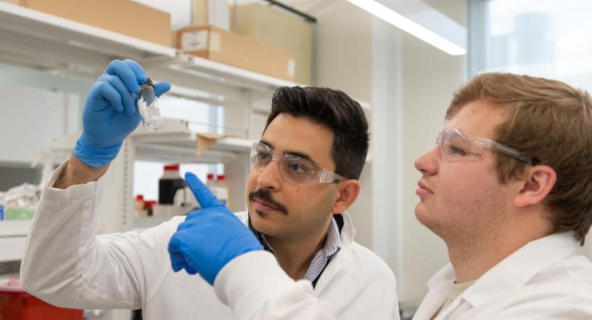 Amir with students in the lab